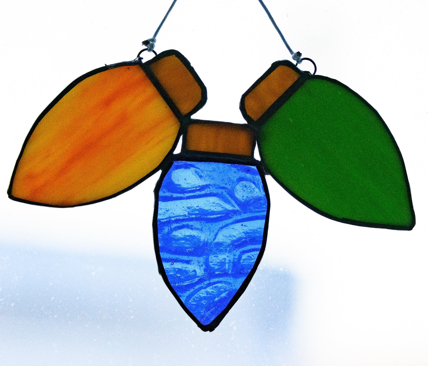 Handmade stained glass Christmas Lights by Through The Pane Studios