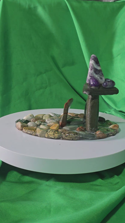 Handcrafted resin base with polished beach stones, upright stone pillars, lentil stone, amethyst cluster and amethyst chevron, epoxy‑set components with polyurethane finish