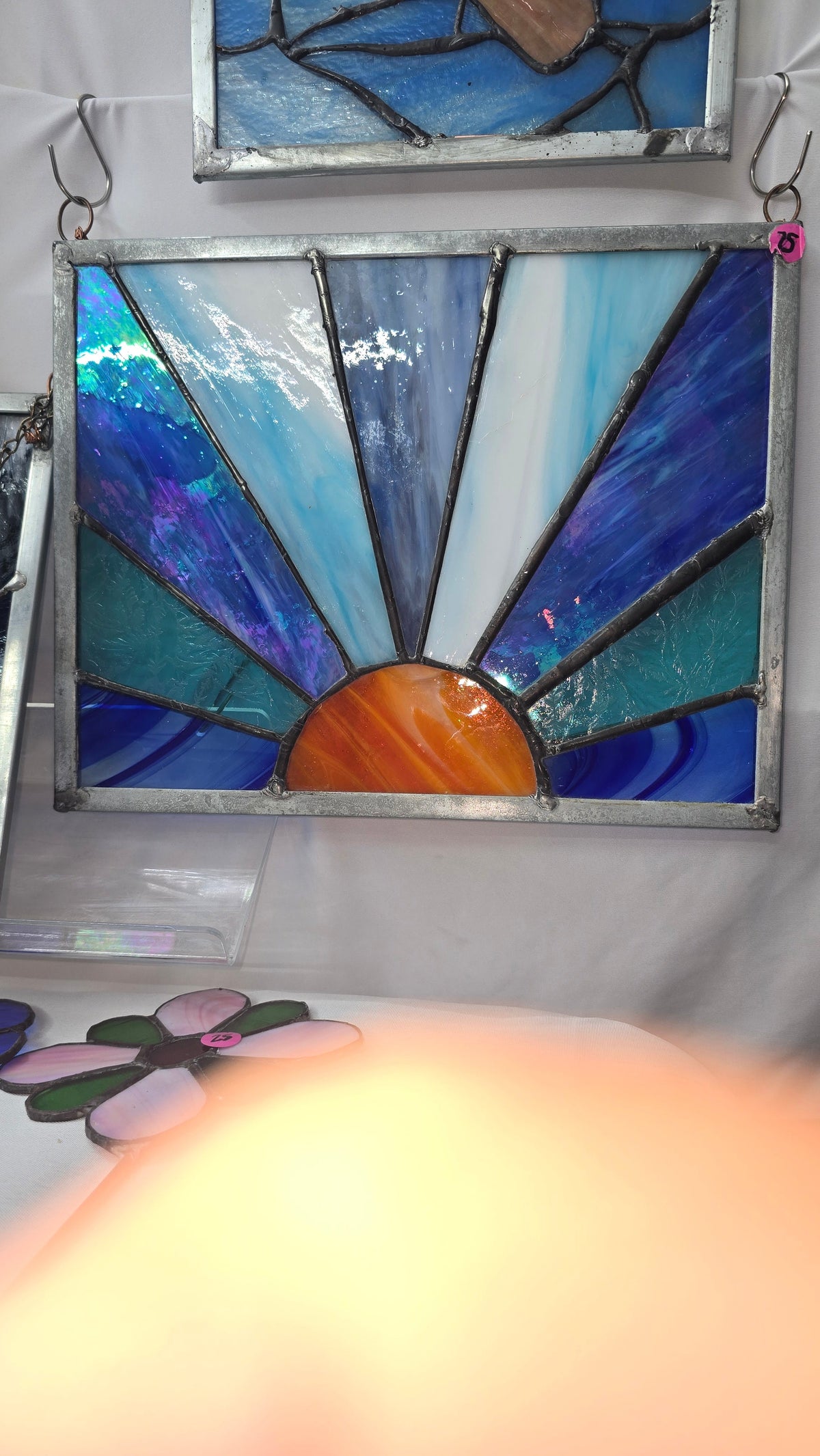 Handmade stained glass Orange sun with blue rays by Through The Pane Studios